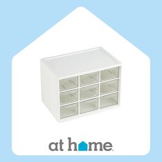 a white drawer with twelve drawers and the words at home above it on a blue background