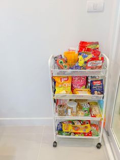 a refrigerator filled with lots of food next to a freezer door in a kitchen