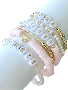 Fun, feminine stretchy name, initial or word bracelets make the perfect outfit accessory! Mix and match the beautiful light pink word bracelets with our accent bracelets for a pop of gold to dress up your bracelet stack.   Each bracelet sold separately ** 👉🏻Bracelets are made with high quality hypoallergenic 18k gold filled spacer beads, heishi beads, and brass beads 📌INSTRUCTIONS: 1. From the Dropdown Menu: >> * SELECT appropriate "Bracelet Length" **Please see photo provided for wrist measurement instructions. Each bracelet is custom made to size. If ordering as a gift, please measure your own wrist and give best educated guess. (Average wrist size is between 6.5-6.75" for reference.) If you have any questions about sizing, please message seller. >> * SELECT from "Bracelet Style" 2. I Trendy White Name Bracelet For Mother's Day, Adjustable Stackable White Charm Bracelet, Elegant White Name Bracelet With Letter Beads, Dainty White Stretch Bracelet As Gift, Trendy White Stretch Bracelet For Mother's Day, Trendy Flexible Stretch Bracelet In White, Trendy Flexible White Stretch Bracelet, Elegant Personalized White Stretch Bracelet, Trendy White Stackable Name Bracelet