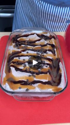 a dish with ice cream and caramel drizzle