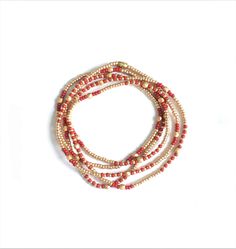 "Bohemian Chis Wrap bracelet with seed beads Beautiful delicate wrap bracelet, wraps around your wrist 5 times. Champagne gold seedbeads* ( 2 mm ) with a hint of coral red and gold plated facetted beads. Also lovely to wear as a long necklace ! S I Z E Medium, 86 cm ( 34 inch) fits the normal to small waist. Please sent me a message for other sizes. *MIYUKI glass beads are considered a \"world standard\" for their high quality, brilliance, and uniform shape. All items are handmade with love and Gold Multi-strand Hand-strung Necklace, Gold Hand-strung Wrap Bracelet For Festivals, Gold Hand-strung Wrap Bracelet Gift, Red Bohemian Bracelets With Gold Beads, Bohemian Gold Waist Beads With Spacer Beads, Gold Bohemian Beaded Bracelets For Festive Occasions, Gold Wrap Bracelet With Tiny Beads As A Gift, Gold Multi-strand Beaded Waist Beads, Bohemian Gold Waist Beads