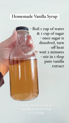 a hand holding a jar filled with liquid and labeled how to use vanilla syrup for baking