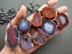 Get fired up with this jaw-dropping raw agate necklace! Simple yet striking, you're sure to turn heads wherever you wear this little beauty! Wear it alone or layer it with our other crystal necklaces for a more intricate boho look. ✧ Rare agates from the famed mines in Coyamito, Mexico ✧ 100% natural stones, NOT dyed or treated ✧ Raw stone nodules with just the front face polished ✧ Stone size 32-48mm long (1.25-1.9 inches) ✧ Select your favorite agate from the dropdown menu ✧ Gunmetal chain in Unique Agate Geodes For Gift, Bohemian Agate Geodes As A Gift, Coyamito Agate, Agate Stone Necklace, Witchy Boho, Raw Stone Necklace, Raw Stone Jewelry, Front Face, Crystal Necklaces