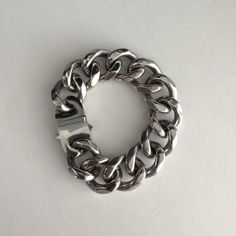 Silver curb chain bracelet, wide curb chain at 1". Buckle closure, 1.5" by 0.75". High shine polished stainless steel, no tarnish, statement piece, heavy duty. Perfect gift for both men and women.  can be made with small chain  We ship in 1-3 days, all purchase come with complimentary jewelry box and pouch and polish cloth. Modern Bracelets With Chunky Cuban Link Chain, Modern Chunky Chain Cuban Link Bracelets, Modern Chunky Cuban Link Chain Bracelet, Modern Chunky Chain Link Bracelets, Modern Silver Cuban Link Bracelet With Chunky Chain, Stainless Steel Cuban Link Bracelet With Chunky Chain, Modern Metal Cuban Link Chain Bracelet, Silver Minimalist Cuban Link Bracelet, Modern Cuban Link Bracelet With Chunky Chain