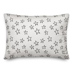 a white pillow with black stars on it