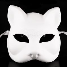 a white cat mask on a black background