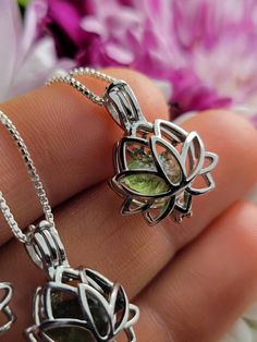 Moldavite Silver Lotus Pendant ~ I will lovingly hand select between one and three small Moldavite tektites to gently fit inside your choice of petite cage pendant. We do our best to fill these sweet little lockets full and ensure they still close securely. Choose your style from the menu above! Each stone is unique, with its own look and personality. These will run a range of bright to olive green hues and may include fractured or carved sides as well as natural terminations. We offer a range o Moldavite Crystal, Moldavite Pendant, Wiccan Necklace, Moldavite Jewelry, Lotus Pendant, Lapis Lazuli Jewelry, Raw Crystal Jewelry, Choose Your Style, Green Hues