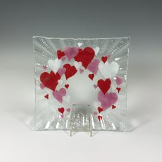 a glass plate with hearts on it