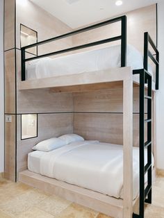 the bunk bed is made up and ready for someone to use it in their home