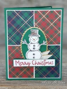 a christmas card with a snowman on the front and green plaid in the back