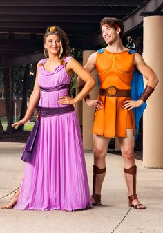 two people dressed in costumes standing next to each other