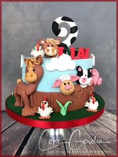 a birthday cake with farm animals on it