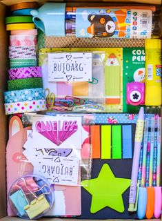 a box filled with lots of different types of stationery and pencils on top of each other