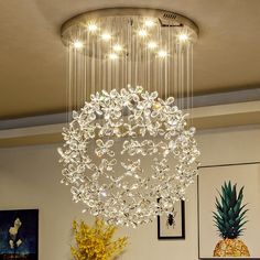 a chandelier hanging from the ceiling in a living room