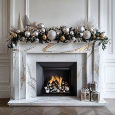 a fireplace decorated with silver and gold ornaments