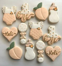 decorated cookies are arranged in the shape of baby's first names and other items