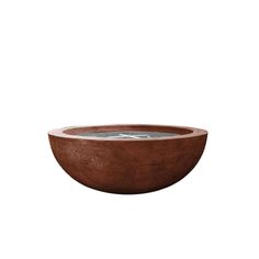 a brown bowl that is sitting on top of a white surface with water in it