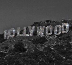 the hollywood sign is lit up in black and white