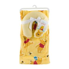 winnie the pooh baby blanket and mitt set in yellow with white ribbon on it