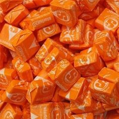 orange cubes with white letters are stacked on top of each other in an image