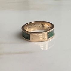 An Antique 15 carat gold mourning ring displaying beautiful hair work around the entire ring. Engraving reads: Died 21st Oct 1841 aged 72 CONDITION: Wear consistent with age and use. Some water damage to hair work. Please see photos for more detail. BAND WIDTH: 5mm RING SIZE: UK: L | US: 5 3/4 WEIGHT: 2.6g (UUZ) Ring Engraving, Ring Displays, Water Damage, Lovely Earrings, Amethyst Ring, Gold Style, Gold Bands, Beautiful Rings, Beautiful Hair