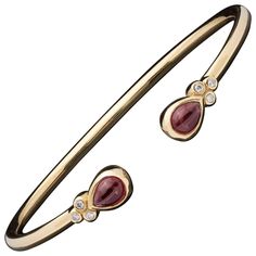 Seeing red?! Wear it with this 18k yellow gold stackable and fun cuff bangle bracelet Designed with two bezel-set cabochon pear-shaped rhodolite garnets, weighing together 2.04cts., and accented by 6 bezel-set round brilliant-cut diamonds. Total diamond weight is 0.09ct. The cuff weighs 12.0 grams, fits a 6 1/2in wrist. and is accompanied by a signed pouch. Inspired by all things Italian, Temple St. Clair's jewels are treasured by devoted collectors. Bezel Set Cabochon, Seeing Red, Diamond Cuff Bracelet, Wide Cuff Bracelets, Gold Armband, Cuff Bangle Bracelet, Hammered Gold, Rhodolite Garnet, Gold Bangle Bracelet