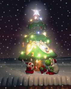 a nintendo wii christmas tree with mario and luigi on it in the snow at night