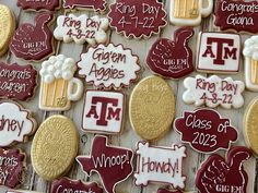 many decorated cookies are arranged on a table with red and white lettering that reads, ` i am, class of 2012 '