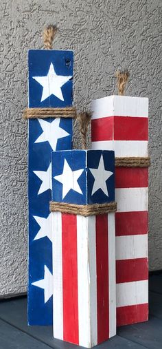 two wooden blocks with stars and stripes painted on them