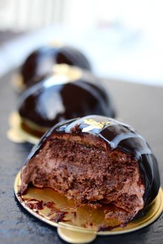 two chocolate cakes sitting on top of each other