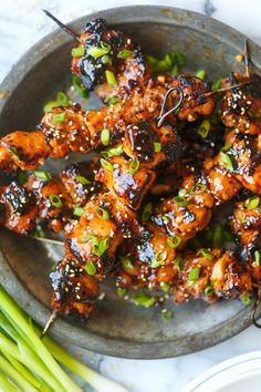 chicken skewers with sesame seeds and green onions