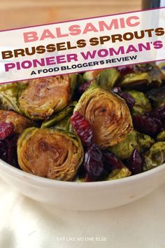 a white bowl filled with brussel sprouts on top of a table