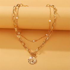 Top off your everyday ensembles with this gleaming 18k gold-plated necklace flaunting a Figaro-style chain and pearl pieces for iridescent accessorizing. Chain 1 : 15.55" L with 2.95" extender Chain 2 : 20.87" L Lobster claw clasp 18k gold-plated copper / pearl