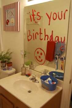 a bathroom with a birthday message on the mirror