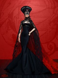 a barbie doll dressed in black and red with a veil on her head, standing against a red background