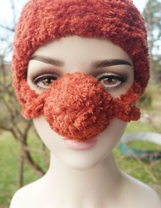 A lovely little thing for a very cold winter - an exceptionally fluffy nose warmer that I crocheted from thick yarn (100% micro polyester). This yarn has the OekoTex Standard 100 certificate, so it is safe for allergy sufferers. This nose warmer is made of brick red yarn. Other colors made of the same yarn can be found here: https://www.etsy.com/listing/1603375881/red-black-nose-warmer-plush-nose?click_key=c883943a12f07f3168b290a2676466a5fe68da54%3A1603375881&click_sum=586be181&ref=shop_home_active_1&sts=1 (red-black) https://www.etsy.com/listing/1332646546/plush-nose-warmer-fluffy-nose-hat?click_key=94fc21b494820680ef1ae9c71b016f7c0471d42c%3A1332646546&click_sum=2c79c93c&ref=shop_home_active_19&crt=1&sts=1 (dark green) https://www.etsy.com/listing/1405370901/furry-nose-plush-nose-warmer-f Novelty Crochet Winter Hat, Cute Red Crochet Winter Hat, Cute Red Crochet Hat For Winter, Orange Crochet Hat For Winter, Crochet Nose, Nose Warmer, Red Yarn, Very Cold, Thick Yarn