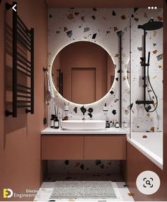 a bathroom with a round mirror above the sink