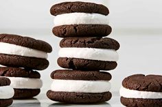 chocolate cookies and marshmallows stacked on top of each other