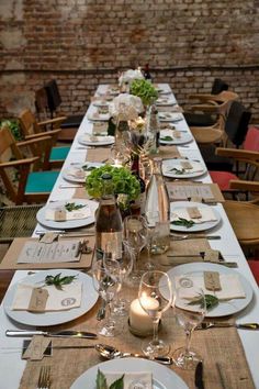 the table is set with place settings for dinner guests to sit down and enjoy their meal