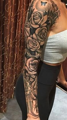 a woman's arm with roses on it