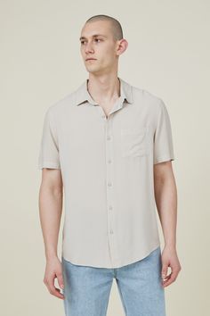 The cuban short sleeve shirt is a staple for your shirts collection. Features a loose fit, button front, chest pocket and short sleeves.

Features:  
- front chest pocket - loose Fit - Classic button up shirt style - Short sleeves - collar Short Sleeve Button-up Shirt With Pockets For Summer, Summer Short Sleeve Button-up Shirt With Pockets, Summer Button-up Short Sleeve Shirt With Pockets, Casual Solid Color Short Sleeve Shirt With Buttons, Casual Solid Short Sleeve Shirt With Button Closure, Solid Color Short Sleeve Shirt With Button Closure, Solid Short Sleeve Shirt With Button Closure, Summer Button-up Short Sleeve Shirt, Summer Short Sleeve Button-up Shirt With Placket