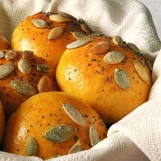 several oranges with seeds in a white bowl