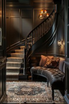 a living room filled with furniture and a stair case next to a rug on the floor