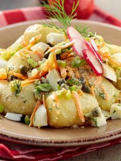 potato salad with radishes and onions on a plate