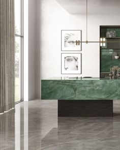 an elegant kitchen with green marble counter tops