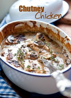 a close up of a bowl of food on a table with the words chutney chicken