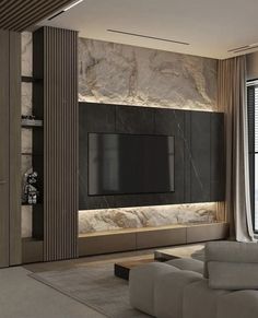 a living room with a large television mounted to the side of it's wall