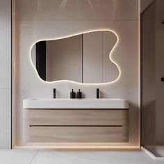 a bathroom with two sinks and a large mirror on the wall above it that is lit up