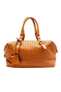 Sophisticated and sexy, this Bottega Veneta is perfect for everyday, or vacay! The Bottega Veneta Intrecciato Leather in Orange, throw on a trench coat and this bag and become Lauren Hutton in American Gigolo. This woven lambskin leather bag is made to the highest standards of quality. It also features a padlock on the side of the purse, and a small clochette and key attached to the adjustable straps. Designer: Bottega Veneta is an Italian luxury fashion house in Milan, Italy. Specialized in lea American Gigolo, Lauren Hutton, Bottega Veneta Intrecciato, Bottega Veneta Shoulder Bag, Orange Leather, Milan Italy, Italian Luxury, Fashion House, Lambskin Leather