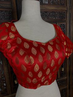 Stitched Pure Banarasi Silk Red Color Blouse with Gold Buttis. Comes with Cups attached to the blouse. Item : BlouseSize : 38 (Comes with extra margin, can be opened to Size 40, 42 )Color : Red Blouse Fabric : Pure Banarasi SilkBlouse Fitting : Princess Cut Lining : Yes, it is fully lined Padded or Non-Padded : Padded Closure: Back Closure with hooks.Ready-to-Wear : YesDisclaimer - : -This is a Standard Size blouse. We do not guarantee perfect fit as every body and shape is different. Little or Color Blouse, Red Blouse, Readymade Blouse, Blouse Work Designs, Blouse Fabric, Red Blouses, Princess Cut, Silk Blouse, Coming Out